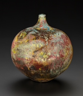 Raku fired bottle vase with red, gold & pearlescent tones