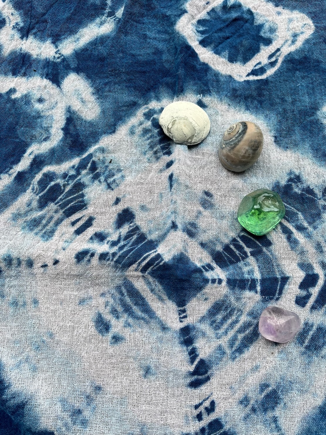 IMG_9395 Indigo Shibori dyed fabric with circular patterns and rocks & shells