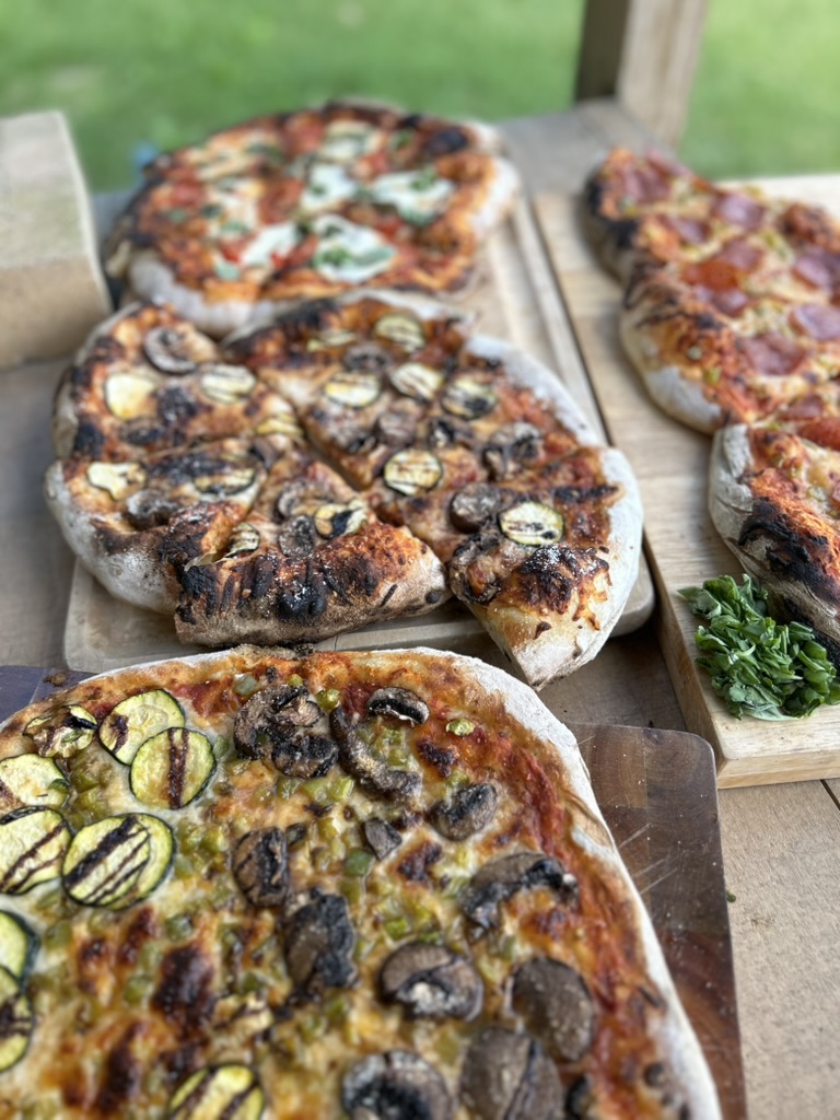 1E6088F1-E6CE-41C7-9F4F-E3B6AB9EBF71_1_105_c wood fired pizzas outside