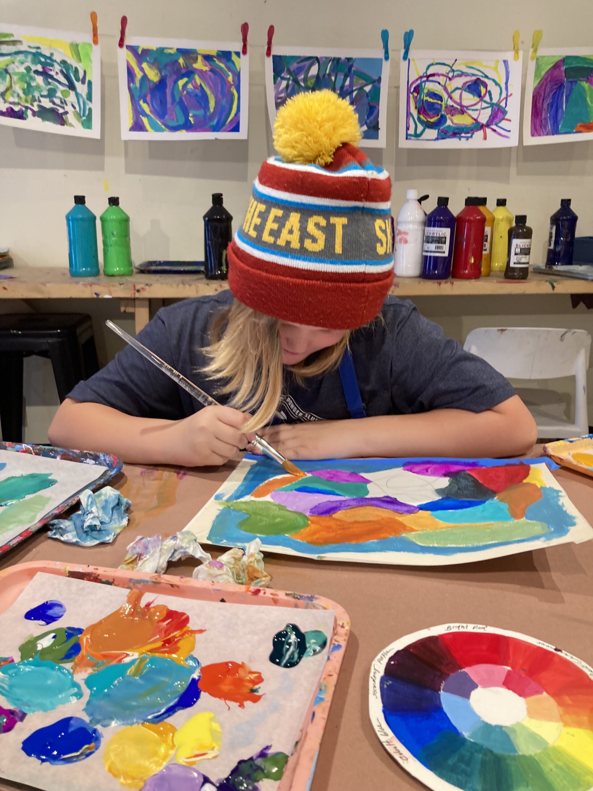 Boy sewing with sewing machine