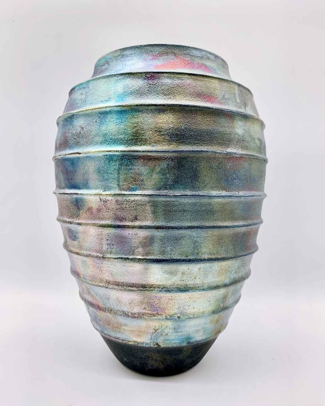 Raku fired pottery with shimmery glaze